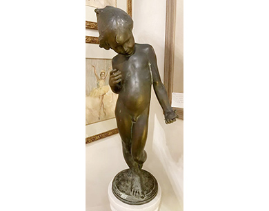 Cast-metal sculpture of a child